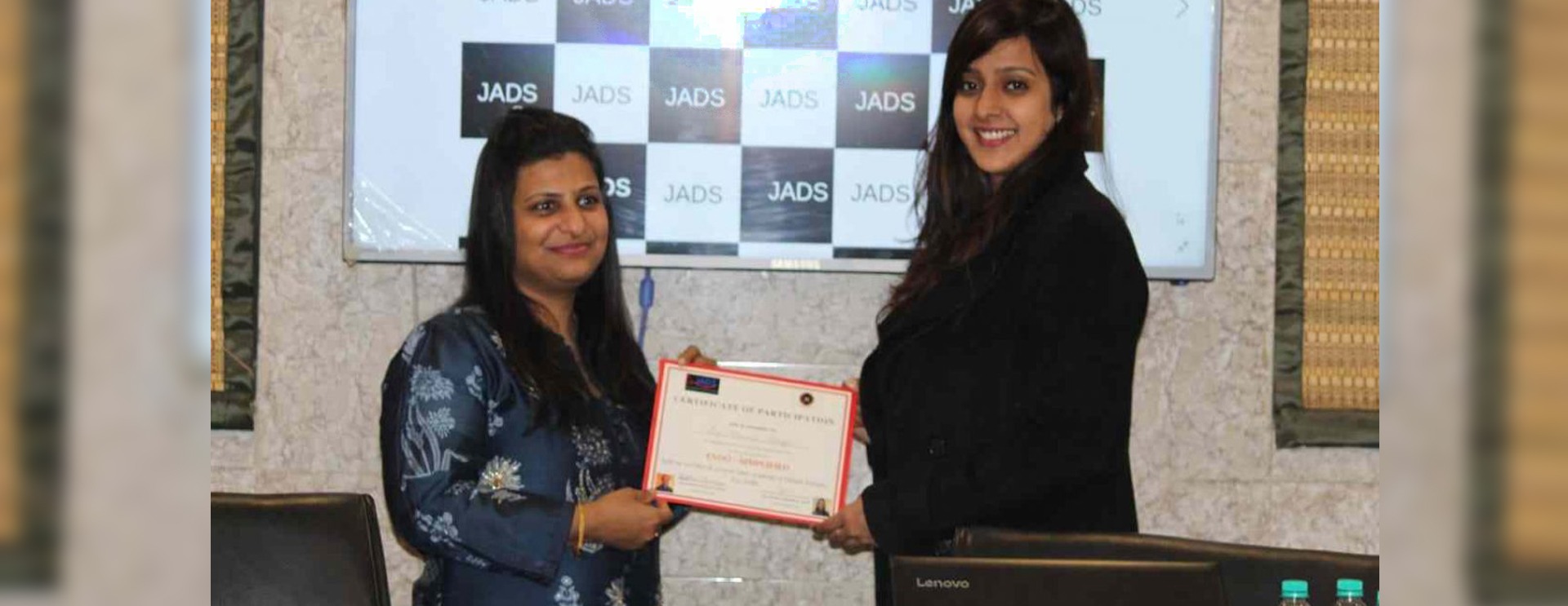 Dr. Rashi Jain giving certificates to the students of the Jain Academy of Dental Sciences, Indirapuram