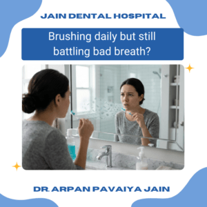 Person worried about bad breath even after brushing teeth in bathroom mirror